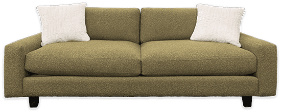 Modern green custom sofa with two white pillows, showcasing Furniture With Attitude’s tailored craftsmanship and comfort.