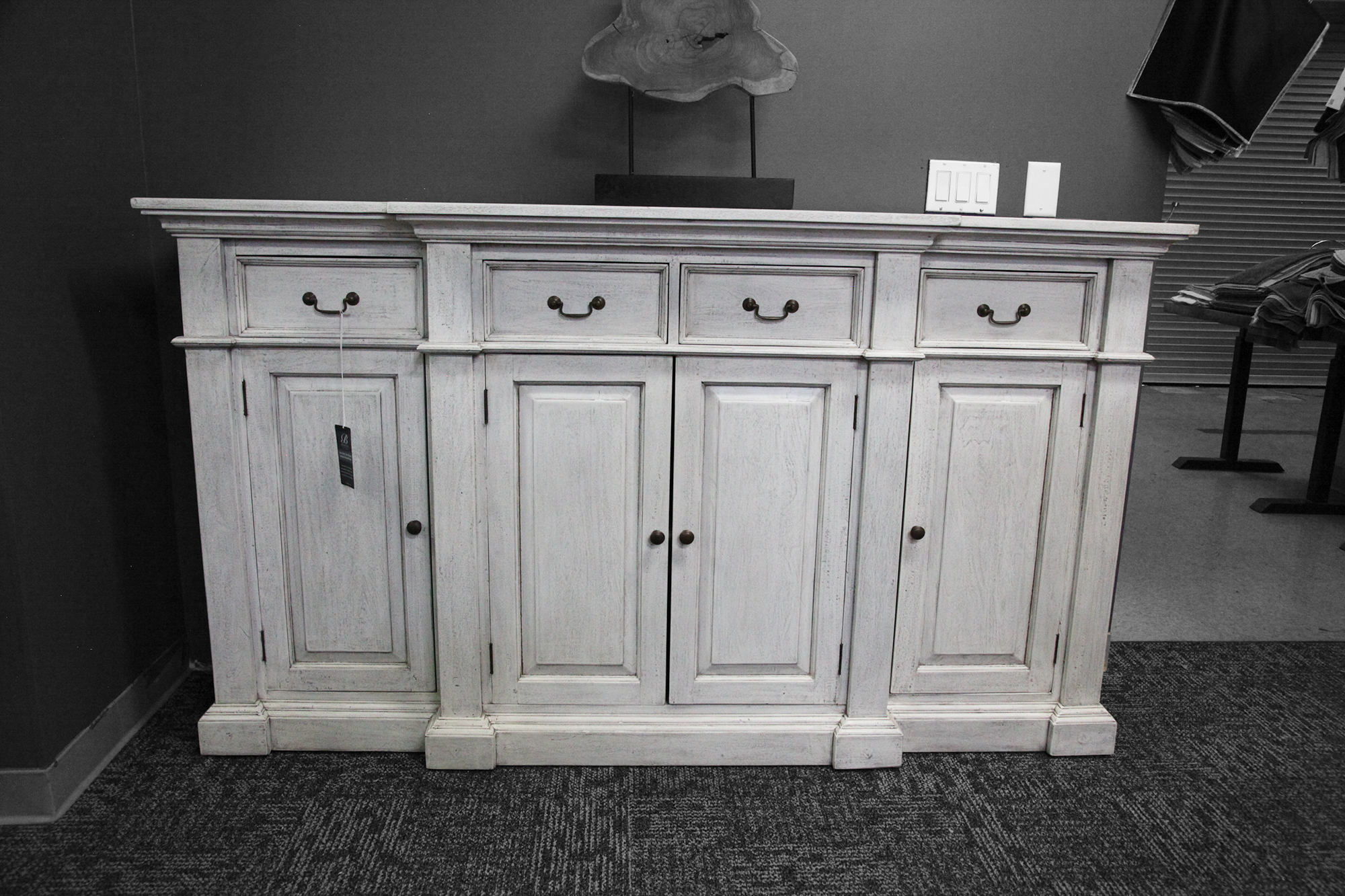 Classic sideboard with clean lines and a whitewashed finish. Features a mix of drawers and cabinets.